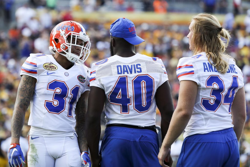 Jan 2, 2017; Tampa , FL, USA; Florida Gators defensive back Teez Tabor (31) talks with linebacker Jarrad Davis (40) and linebacker Alex Anzalone (34) during a timeout in the second quarter against the Iowa Hawkeyes at Raymond James Stadium. Mandatory Credit: Logan Bowles-USA TODAY Sports