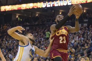 January 16, 2017; Oakland, CA, USA; Cleveland Cavaliers forward LeBron James (23) shoots the basketball against Golden State Warriors center JaVale McGee (1) during the first quarter at Oracle Arena. Mandatory Credit: Kyle Terada-USA TODAY Sports