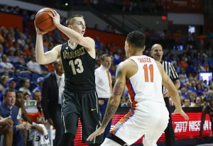 Jan 21, 2017; Gainesville, FL, USA;Vanderbilt Commodores guard Riley LaChance (13) controls the ball against Florida Gators guard Chris Chiozza (11) during the first half of an NCAA basketball game at Exactech Arena at the Stephen C. O'Connell Center. Mandatory Credit: Reinhold Matay-USA TODAY Sports