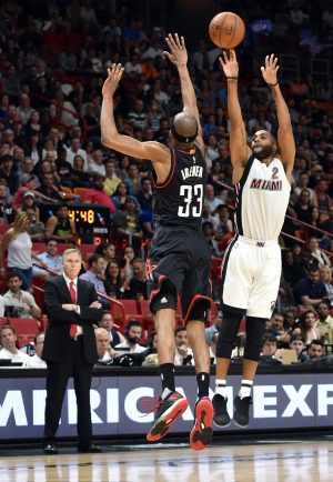 Jan 17, 2017; Miami, FL, USA; Houston Rockets head coach Mike D'Antoni (left) watches as Miami Heat guard Wayne Ellington (right) make a three point basket over Houston Rockets forward Corey Brewer (33) during the second half at American Airlines Arena. The Heat won 109-103. Mandatory Credit: Steve Mitchell-USA TODAY Sports