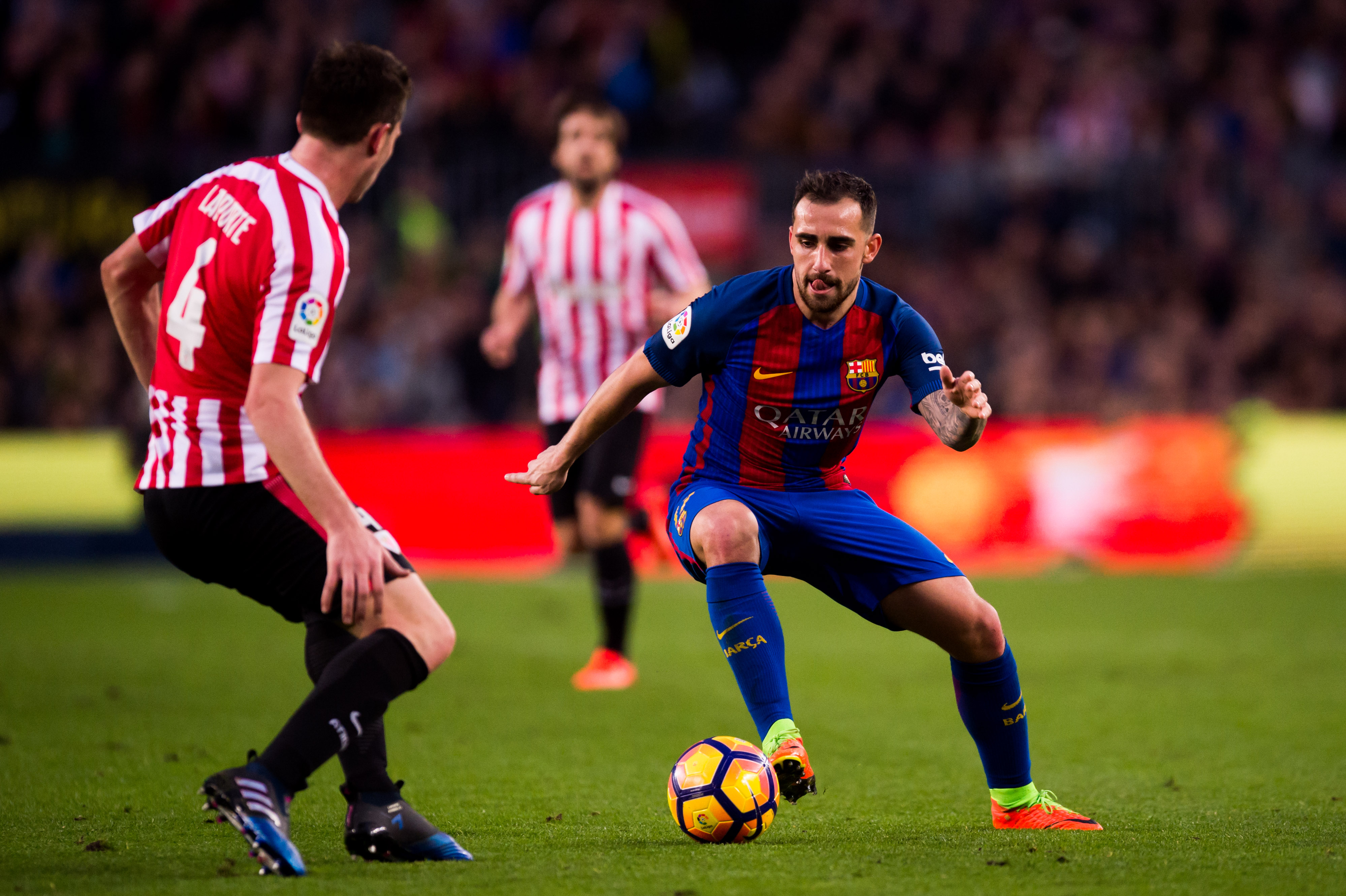 BARCELONA, SPAIN - FEBRUARY 04: Paco Alcacer of FC Barcelona dribbles Aymeric Laporte of Athletic Club during the La Liga match between FC Barcelona and Athletic Club at Camp Nou stadium on February 4, 2017 in Barcelona, Spain. (Photo by Alex Caparros/Getty Images)