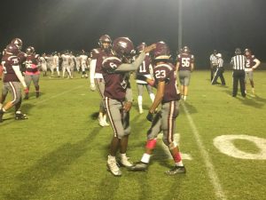 Oak Hall player celebrates with teammate