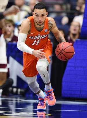 Mar 11, 2016; Nashville, TN, USA; Florida Gators guard Chris Chiozza (11) dribbles the ball up the floor in the second half of the SEC conference tournament against the Texas A&M Aggies at Bridgestone Arena. Texas A&M Aggies won 72-66. Mandatory Credit: Christopher Hanewinckel-USA TODAY Sports