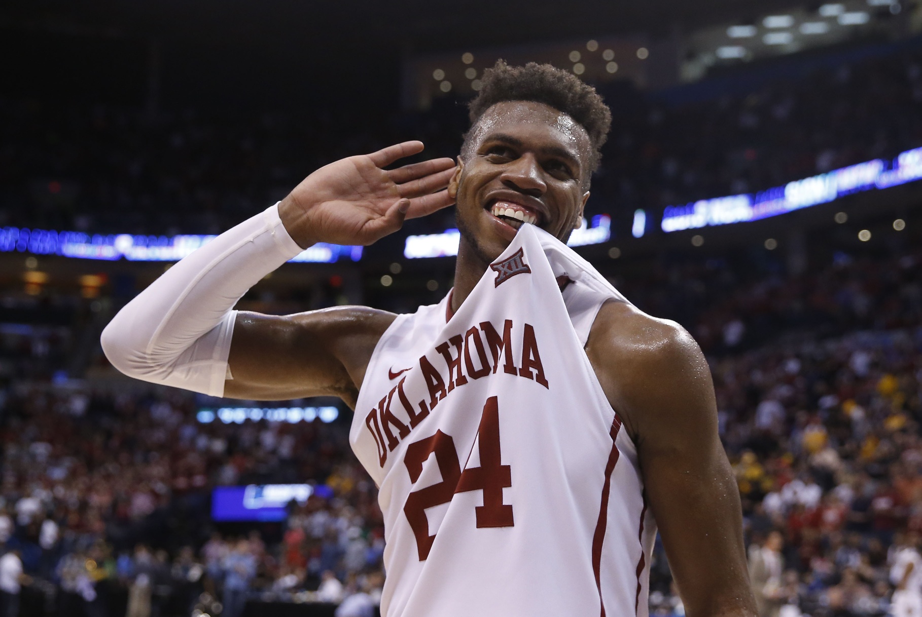 Oklahoma guard Buddy Hield, left, passes around Texas A&M guard