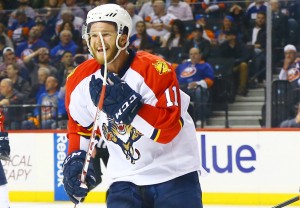 Apr 20, 2016; Brooklyn, NY, USA; Florida Panthers left wing Jonathan Huberdeau (11) reacts after his teammate defenseman Alex Petrovic (not pictured) scored the game winning goal against the New York Islanders during the third period of game four of the first round of the 2016 Stanley Cup Playoffs against the Florida Panthers at Barclays Center. The Panthers won 2-1. Mandatory Credit: Andy Marlin-USA TODAY Sports