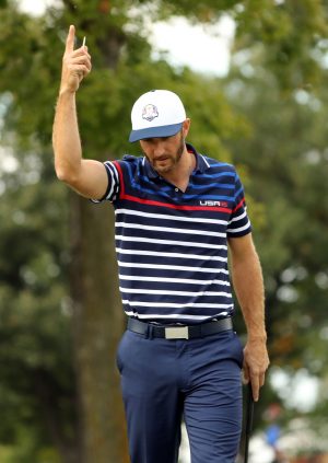 Sep 29, 2016; Chaska, MN, USA; Dustin Johnson of the United States reacts Matt Kuchar of the United States (not pictured) makes a putt on the 12th hole during a practice round for the 41st Ryder Cup at Hazeltine National Golf Club. Mandatory Credit: Rob Schumacher-USA TODAY Sports