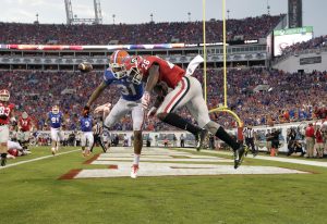 Oct 31, 2015; Jacksonville, FL, USA; Florida Gators defensive back Jalen Tabor (31) breaks up a pass to Georgia Bulldogs wide receiver Malcolm Mitchell (26) as Florida Gators defensive back Brian Poole (24) (not pictured) intercepted the ball during the second half at EverBank Stadium. Florida Gators defeated the Georgia Bulldogs 27-3. Mandatory Credit: Kim Klement-USA TODAY Sports