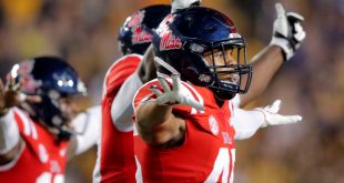 Ole Miss players celebrate after a missed field goal by LSU