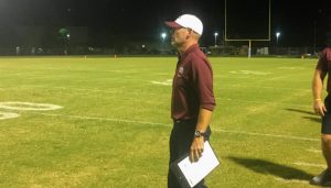 Oak Hall coach watches game