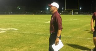 Oak Hall coach watches game