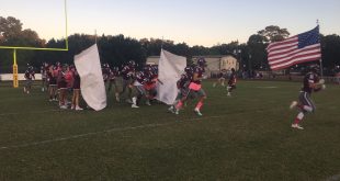 football team runs onto field