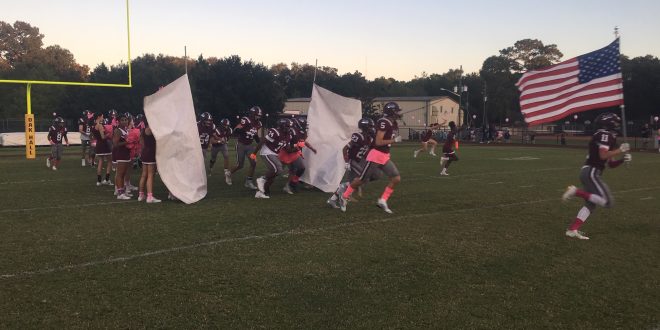 football team runs onto field