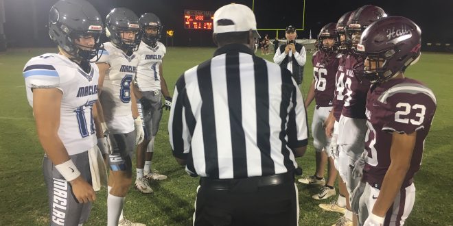 Maclay and Oak Hall captains line up for coin toss prior to game