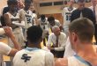 Chris Mowry leads huddle during timeout