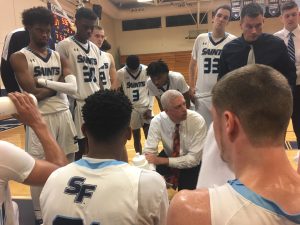 Chris Mowry leads huddle during timeout