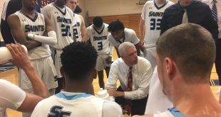 Chris Mowry leads huddle during timeout