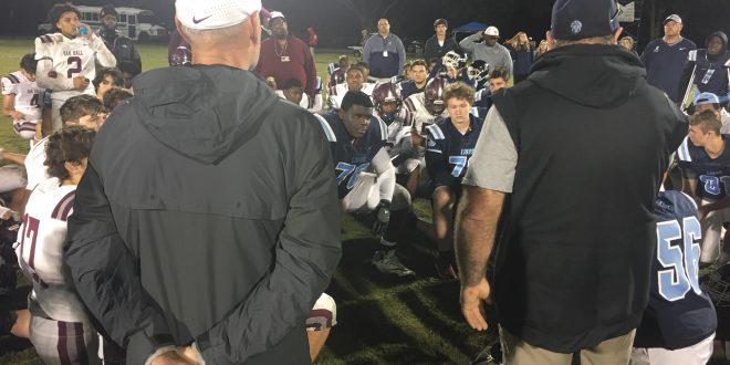 Oak Hall and Foundation Academy coaches talk to players