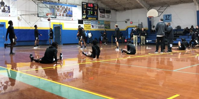 Hawthorne basketball team stretches pre-game