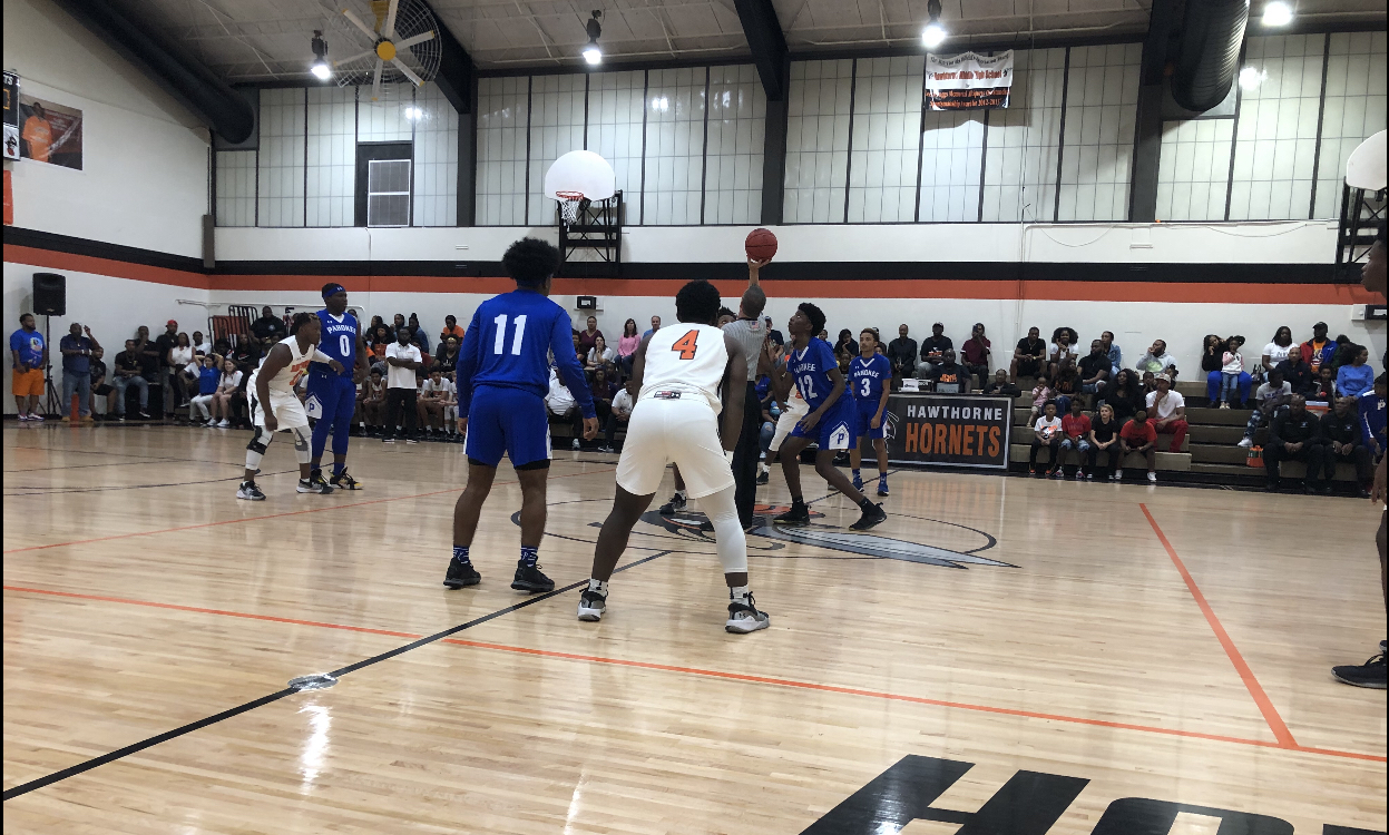 Jump ball at Hawthorne boys' basketball game