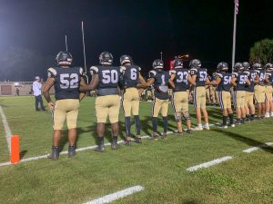 Buchholz football players take the field