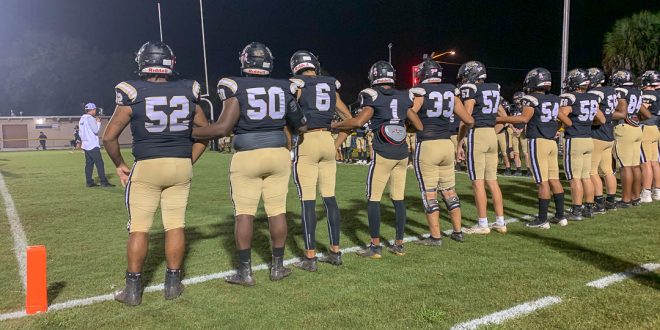 Buchholz football players take the field