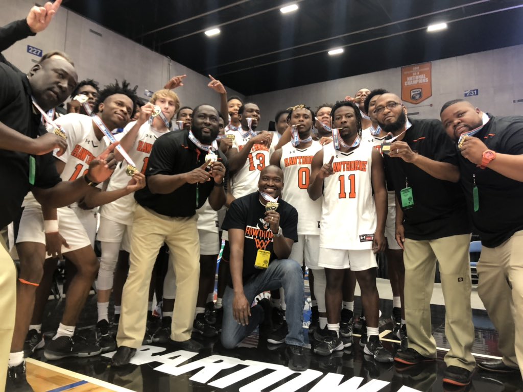 Hawthorne basketball players pose with medals