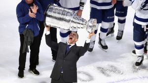 Julien Brisebois raises the Stanley Cup. ( Bruce Bennett/Getty Images)