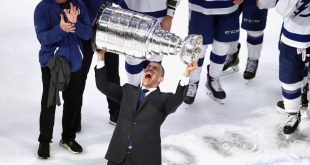 Julien Brisebois raises the Stanley Cup. ( Bruce Bennett/Getty Images)