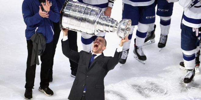 Julien Brisebois raises the Stanley Cup. ( Bruce Bennett/Getty Images)