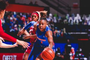 Gator women's basketball player dribbles