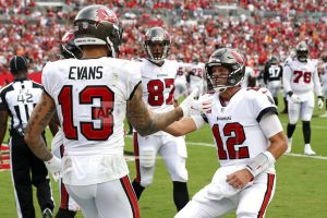 Buccaneers high-five on sideline