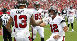 Buccaneers high-five on sideline