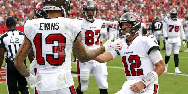 Buccaneers high-five on sideline