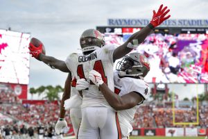 Buccaneers players chest bump after scoring