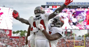 Buccaneers players chest bump after scoring