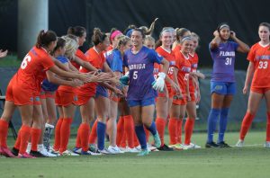 Gators soccer high-five down sideline