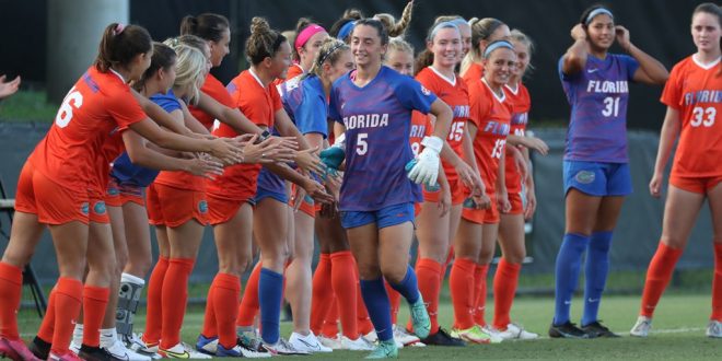 Gators soccer high-five down sideline