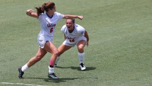 Gator soccer players running