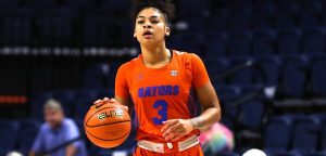Gator women's basketball player dribbles the ball