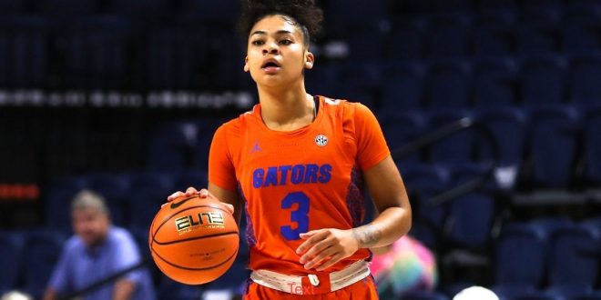 Gator women's basketball player dribbles the ball