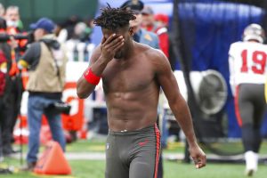 Shirtless Antonio Brown exits the field