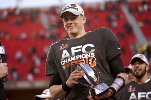 Joe Burrow holds AFC trophy