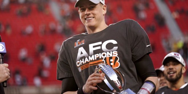 Joe Burrow holds AFC trophy