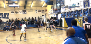 #0 Reggie White soars for a layup off of a steal.