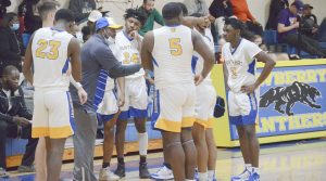 players huddle before honoring Mahki Bostic
