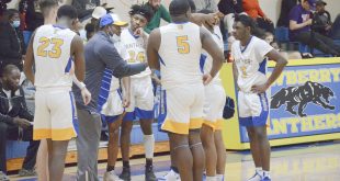 players huddle before honoring Mahki Bostic