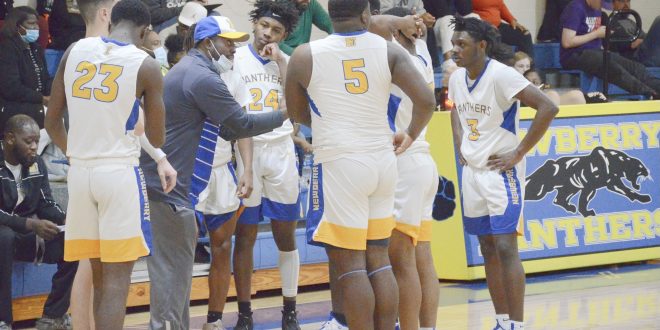 players huddle before honoring Mahki Bostic