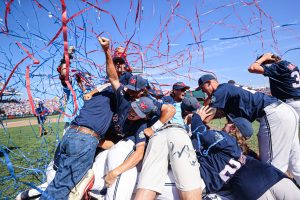 Ole Miss celebrates with a dogpile after striking out the last three Sooners to secure their title as the 2022 Men's College World Series National Champions.