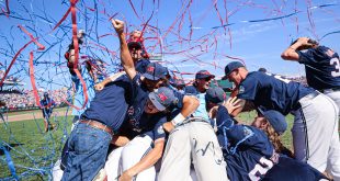 Ole Miss celebrates with a dogpile after striking out the last three Sooners to secure their title as the 2022 Men's College World Series National Champions.