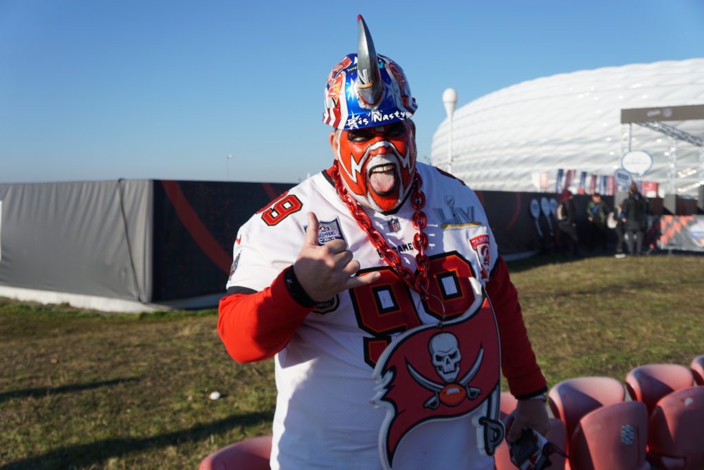 Buccaneers fan dressed up in face paint, special jersey and horned hat